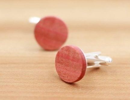Pink Ivory Wood Cufflinks are handcrafted accessories made from the rare and precious wood of the Pink Ivory tree, known for its beautiful pink hue and durability. These cufflinks add a touch of elegance and sophistication to any formal attire, making them the perfect choice for special occasions or as a unique gift for someone special.
