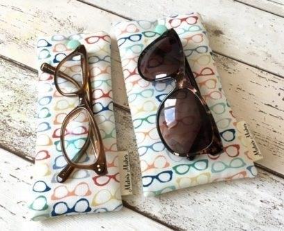 The Ivory Glasses Case with a Glasses Print is a stylish and practical accessory to keep your glasses safe and protected.
