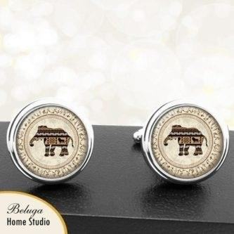 These brown, tan, and ivory elephant African pattern handmade cufflinks are a stylish and unique accessory that adds sophistication and cultural flair to any outfit.