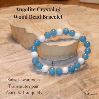 The Blue Angelite Crystal and Ivory Wood Bead Bracelet is a beautiful piece of jewelry that combines the calming energy of angelite crystal with the natural elegance of ivory wood beads. This bracelet is perfect for adding a touch of bohemian style to any outfit and is sure to catch the eye with its unique combination of colors and textures. Whether worn alone or layered with other bracelets, this piece is a must-have for any jewelry lover.
