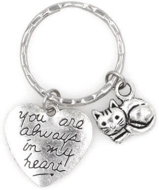 A keepsake keychain is a small item that holds sentimental value, often used to commemorate special moments or to symbolize a meaningful connection or memory.