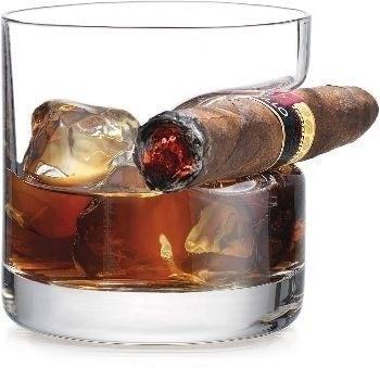The Whiskey Glass with Cigar Holder is a stylish and functional accessory that allows you to enjoy your favorite whiskey while also securely holding your cigar for a luxurious and convenient experience.