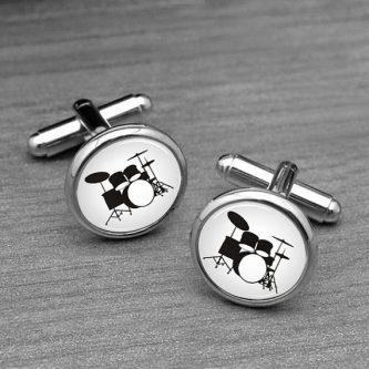 Drum Kit Cufflinks are a stylish accessory for music enthusiasts, featuring miniature drums and drumsticks that add a touch of rhythm and creativity to any formal attire.