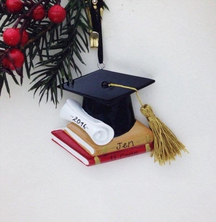 A personalized graduation Christmas ornament is a special keepsake that commemorates the achievement of completing one's education during the festive holiday season.