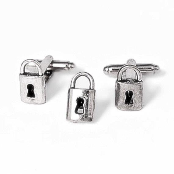 Silver Lock Cufflinks and Tie Tack are elegant accessories that add a touch of sophistication and style to any formal outfit, perfect for a special occasion or professional setting.
