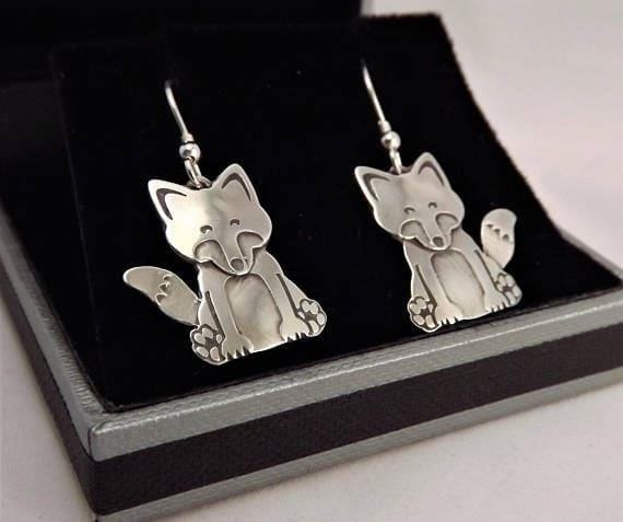 Fox Drop Earrings are a trendy fashion accessory, designed with a charming fox motif and dangling beads or gemstones, perfect for adding a touch of whimsy and style to any outfit.