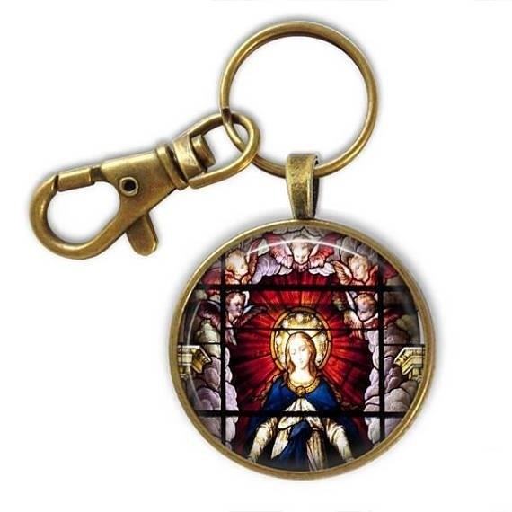 The Virgin Mary Keychain is a small token that symbolizes devotion and faith in the Catholic religion, often carried as a reminder of the Virgin Mary's loving and protective presence.