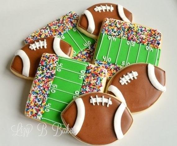Football & Stadium Cookies are delicious treats that are shaped like footballs and stadiums. These cookies are perfect for sports-themed parties or game day gatherings. They are made with a buttery and sweet dough that is carefully molded into the shape of a football or a stadium. The cookies are then baked until they are golden brown and crispy on the outside, while still soft and chewy on the inside. They can be decorated with icing to resemble the markings on a football or the seating arrangement of a stadium. These cookies are sure to be a hit with football fans of all ages!