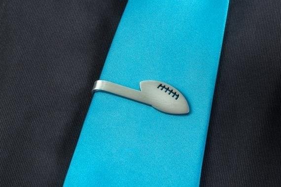 A football tie clip is a stylish accessory that adds a touch of sportsmanship to any outfit, perfect for showing off your love for the game.