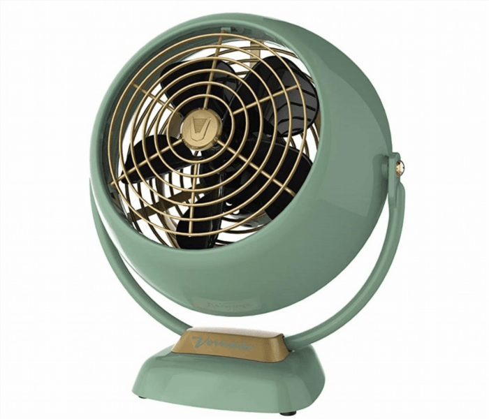 The vintage aluminum fan is a classic piece of machinery that adds a touch of nostalgia to any room with its sleek design and cool breeze.