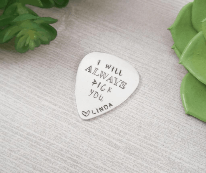 A stamped guitar pick is a collectible item that features a unique design or logo, adding a touch of personalization to the musician's instrument.