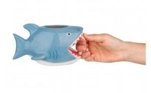 The Shark Bite Coffee Mug is a novelty item that features a design resembling a shark bite, making it a fun and eye-catching addition to your collection of coffee mugs.