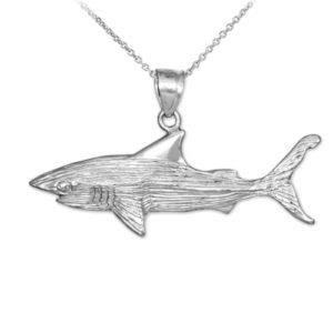 The Shark Pendant is a stylish and trendy accessory that adds a touch of elegance to any outfit, perfect for those who want to make a bold fashion statement.