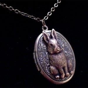 The Antiqued Brass Bunny Rabbit Locket is a charming piece of jewelry that showcases a vintage style and features a locket design with an adorable bunny rabbit motif.