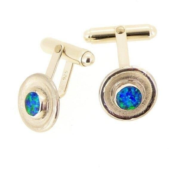 Blue Opal and Sterling Silver Cufflinks are a stylish and elegant accessory, perfect for adding a touch of sophistication to any formal outfit.