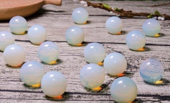 Natural Clear Opalite Beads are known for their translucent and iridescent qualities, making them a popular choice for jewelry making and crafting.