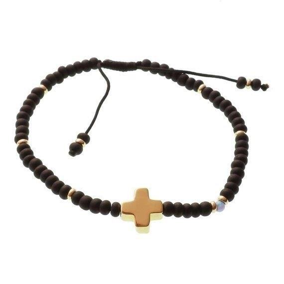 The Black Opal Bead Cross Bracelet is a stunning piece of jewelry that combines the elegance of black opal beads with the symbolism of a cross, creating a beautiful accessory with spiritual significance.