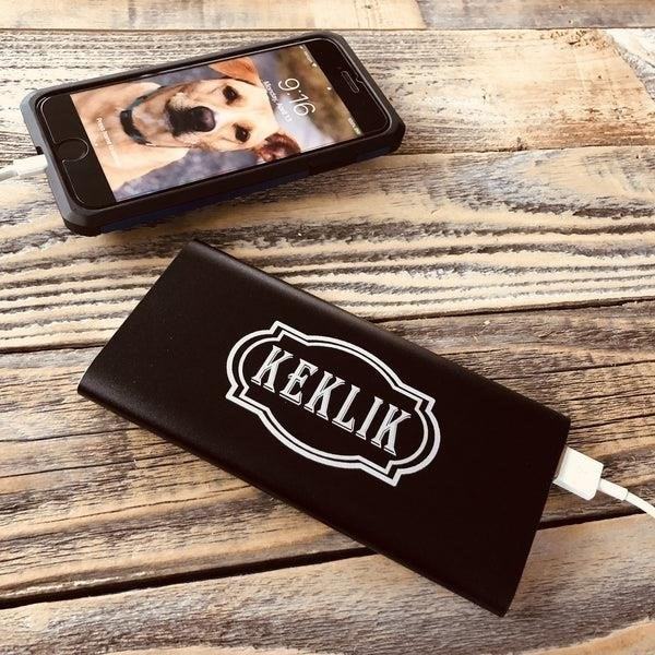 A personalized power bank is a portable device that can store and provide electrical energy to charge various electronic devices, making it convenient for individuals to stay connected and powered up on the go.