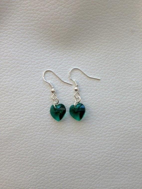 Heart-Shaped Emerald Earrings are a stunning piece of jewelry that beautifully showcases the elegance and beauty of emeralds, making them a perfect accessory for any special occasion or gift.