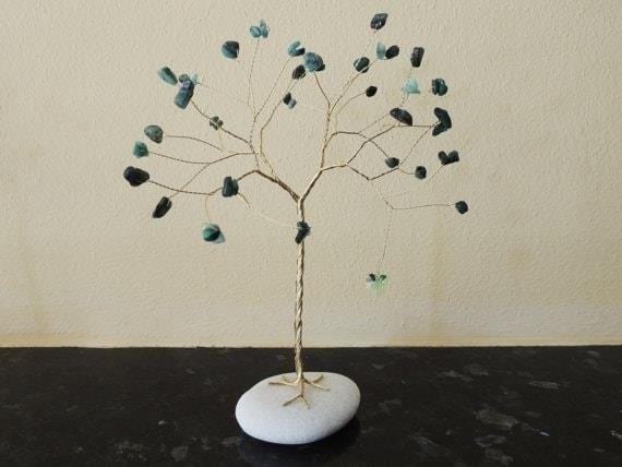 The Tree Sculpture with Emerald Leaves is a stunning work of art that showcases the beauty of nature, bringing a touch of elegance and tranquility to any space.