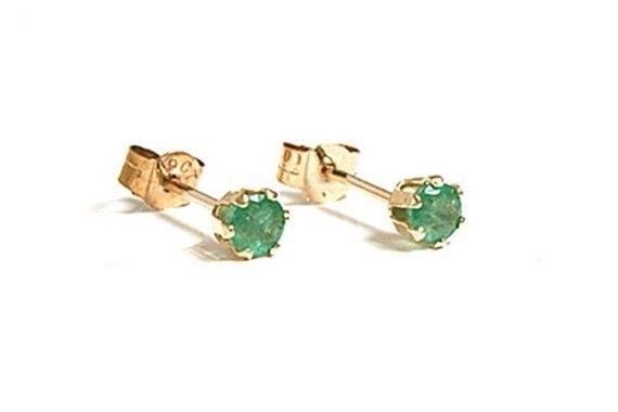 Small Gold Emerald Stud Earrings are a timeless and elegant accessory that adds a touch of sophistication to any outfit. These delicate earrings feature a stunning emerald gemstone set in a beautiful gold stud design, creating a subtle yet glamorous look. Perfect for both casual and formal occasions, these earrings are a must-have addition to any jewelry collection.