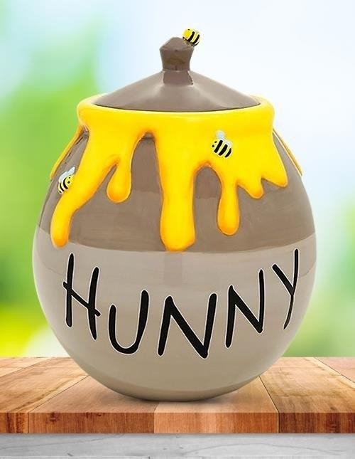 Winnie the Pooh Cookie Jar is a delightful collectible item that features the lovable bear character from the popular children's book series. It is perfect for storing your favorite cookies while adding a touch of whimsy to your kitchen decor.