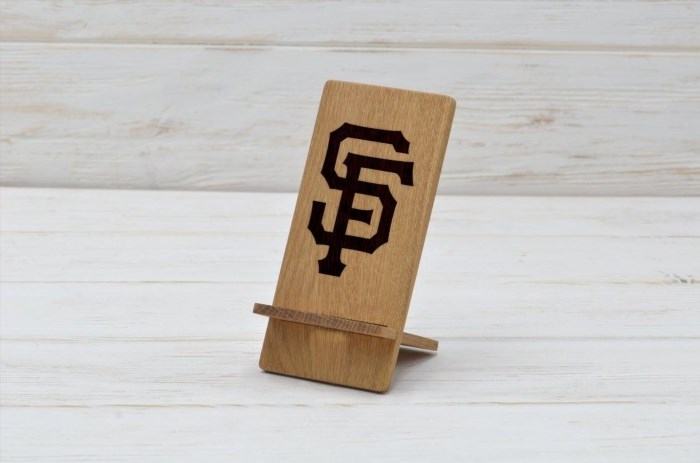 The San Francisco Wooden Phone Stand is a stylish and practical accessory that adds a touch of elegance to any desk or table setting. Crafted from high-quality wood, it not only holds your phone securely in place but also adds a natural and rustic charm to your space. With its sleek and minimalist design, it seamlessly blends into any decor, making it a perfect addition to your home or office. Its sturdy construction ensures durability, while its compact size makes it easy to carry and use on the go. Whether you're watching videos, browsing the internet, or video chatting with friends and family, the San Francisco Wooden Phone Stand provides a convenient and hands-free viewing experience. Elevate your phone and elevate your style with this exquisite accessory.
