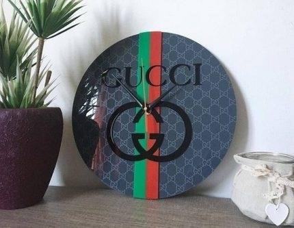 The Gucci Wall Clock is a luxurious and stylish timepiece, designed with impeccable craftsmanship and attention to detail. Its sleek design and iconic Gucci branding make it a perfect addition to any modern home or office.