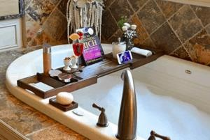 A Bath Caddy is a convenient and practical accessory that enhances your bathing experience, providing a place to store and organize your essentials such as soap, shampoo, and a book or tablet for entertainment.