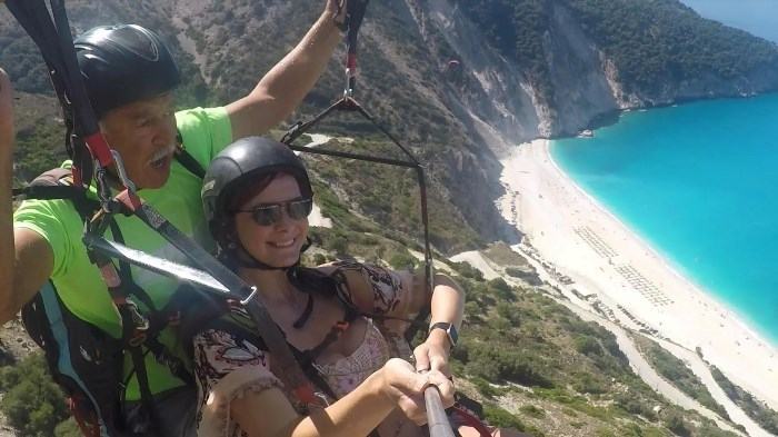 Paragliding over Myrtos Beach in Greece offers an exhilarating experience, allowing you to soar through the sky while enjoying panoramic views of the crystal-clear turquoise waters and the stunning coastline.