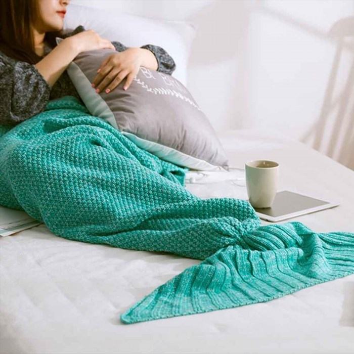 A Crochet Mermaid Tail Blanket is a cozy and whimsical blanket that resembles the lower half of a mermaid, perfect for snuggling up and feeling like a magical creature.