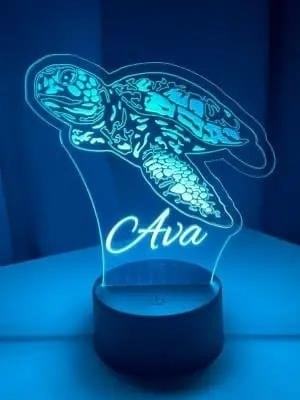 The personalized sea turtle lamp created by Coosaw Customs is a unique and artistic piece that adds a touch of charm to any space. Handcrafted with attention to detail, this lamp showcases the beauty of sea turtles while providing a warm and inviting glow. Perfect for those who appreciate a personalized touch in their home decor, this lamp is a true work of art.