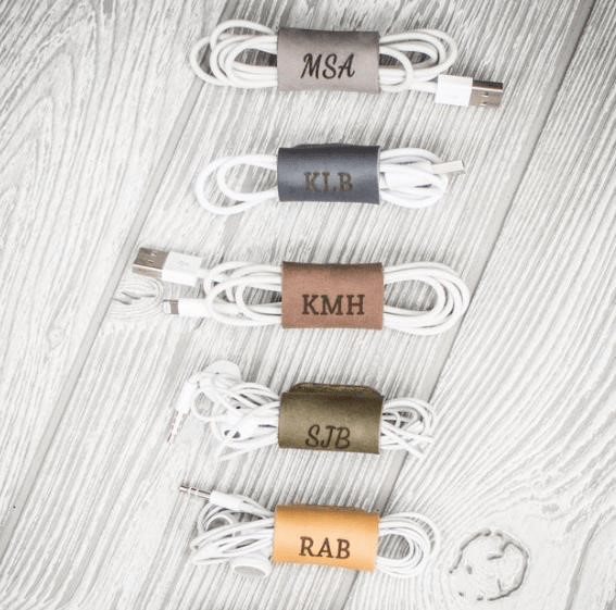 A personalized leather cord keeper is a stylish and practical accessory that helps keep your cords organized and tangle-free.