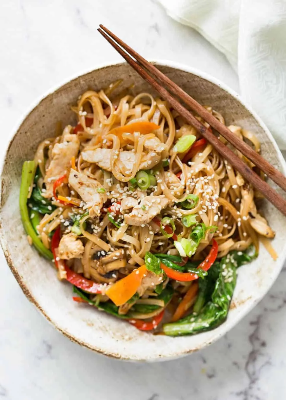 Great fridge forage meal - any dried noodles, any veggies, optional protein. This Chicken Stir Fry with Rice Noodles is healthy and super quick to make! recipetineats.com