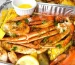 A delicious seafood bake with crab legs, shrimp, and corn.