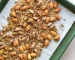 Almonds, pistachios and seasonings on baking sheet