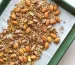 Almonds, pistachios and seasonings on baking sheet