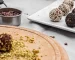 Cacao Truffles being rolled in pistachios