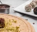 Cacao Truffles being rolled in pistachios