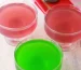 Red and green vegan jello in glass dishes.