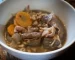 white bowl containing mushroom stew with Opies pickled walnuts